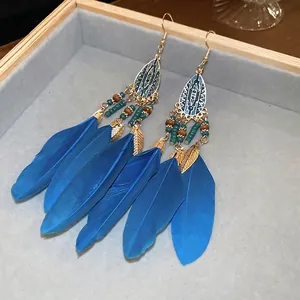 Bohemian blue feather drop earrings with gold metal leaf accents and beaded tassels