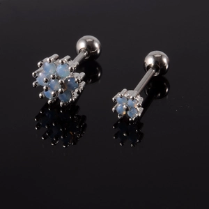 Macro shot of stainless steel helix stud earrings with blue opal bead clusters on black glass