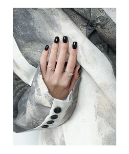 Close-up of minimalist S925 sterling silver rings with micro-set zircon on model hand
