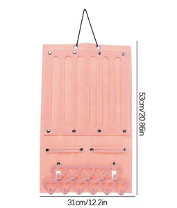 Pink felt jewelry wall organizer with dimensions 53cm by 31cm showing storage slots