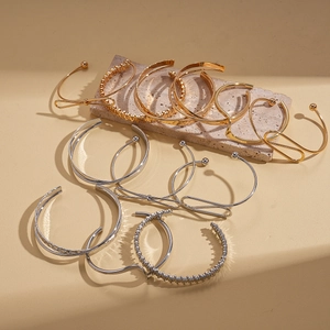 Set of 6 gold and silver irregular geometric metal bracelets with high-polish finish
