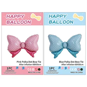 Polka dot bow-shaped foil balloons in pink and blue for kids birthday party decoration