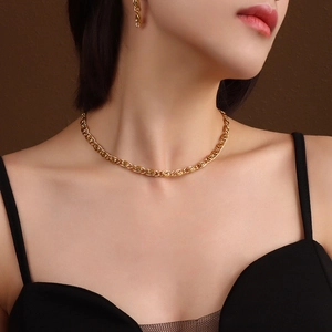 Minimalist 18K gold-plated chunky link chain necklace worn by a fashion model