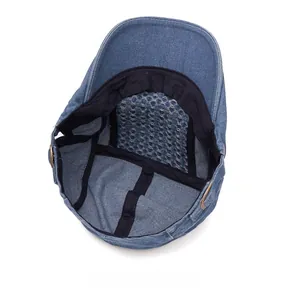 Detail of the internal breathable mesh lining and metal buckle of the denim beret hat