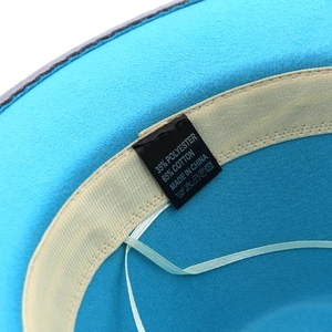 Sky blue wool felt fedora with beige inner band and detailed material care label