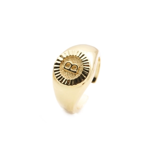 Detailed view of polished gold plated ring featuring a capital letter B signet design