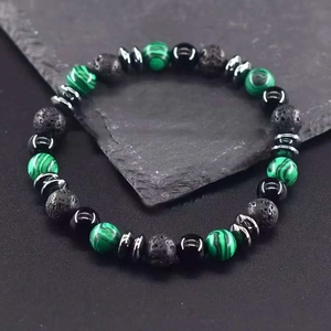 Men's 8mm beaded bracelet featuring green tiger eye stones and black volcanic lava rocks