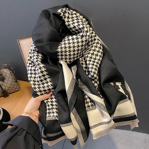 Classic black and white houndstooth scarf with H-letter pattern and tassels