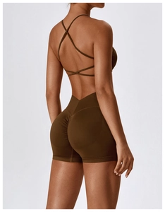 Close-up of olive green seamless yoga set featuring cross back straps and scrunch shorts