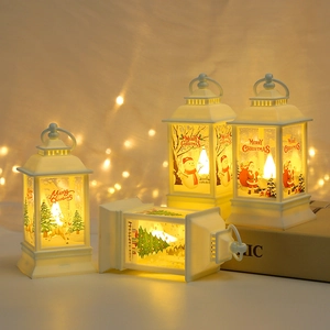 Close-up of four white LED Christmas lanterns with Santa and reindeer festive patterns