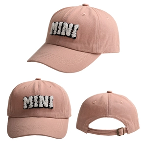 Detailed views of a pink baseball cap showing the MINI embroidery and metal buckle closure
