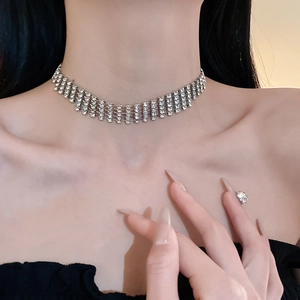 Close-up of five-layer sparkling rhinestone choker necklace on model's neck
