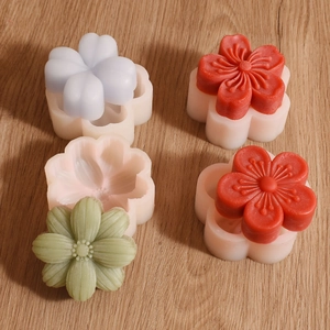 Detailed macro view of 3D flower silicone molds with sunflower and clover shaped soap crafts