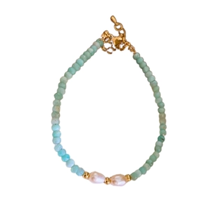 Elegant Amazonite and pearl beaded bracelet with gold lobster clasp on white backdrop