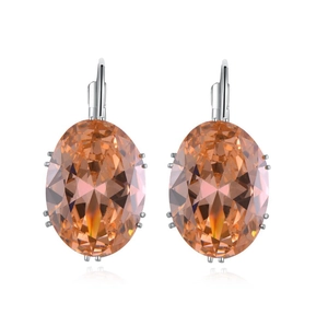 Elegant silver earrings with oval orange zircon stones on a white background