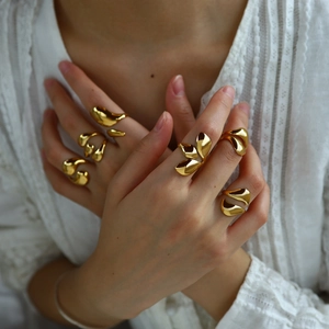18K gold plated stainless steel lava open rings with irregular fluid design on model's hand
