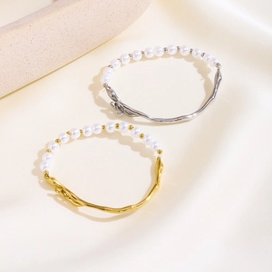 Elegant gold and silver pearl bracelets with organic geometric titanium steel texture