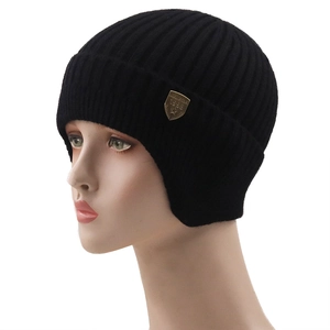Winter men's black ribbed knit beanie with ear flaps and a metal shield badge detail