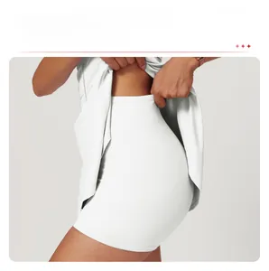 Detail view of white tennis dress showing high-elasticity built-in inner shorts for protection