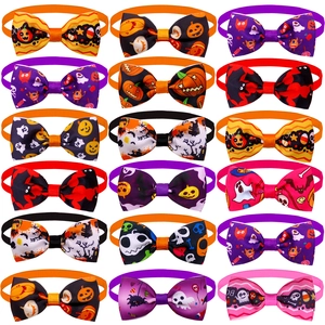 Detailed view of eighteen assorted Halloween pet bow ties with pumpkin and ghost patterns