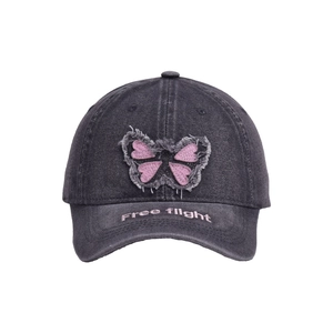 Distressed dark grey denim baseball cap with butterfly patch and Free Flight embroidery