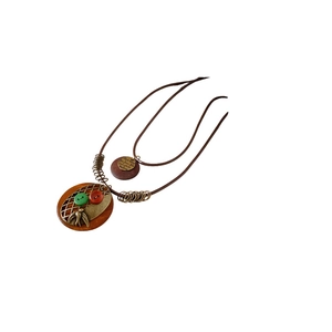 Ethnic handmade long necklace with wooden bird pendant and colorful buttons on wax cord