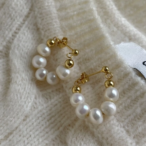 Elegant 925 sterling silver hoop earrings featuring white freshwater pearls and gold beads