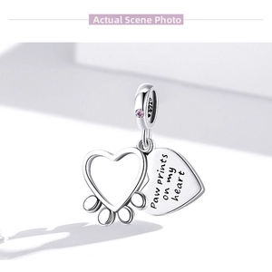 Detail of S925 sterling silver heart charm with paw print and engraved heart message