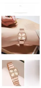 Detail view of square women watch in rose gold with a minimalist dial and metal mesh strap