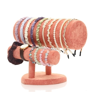 Dual-tier coral velvet headband and bracelet display stand with a stable semi-circular base