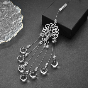 Rainbow garden suncatcher featuring a silver tree of life and faceted crystal prisms