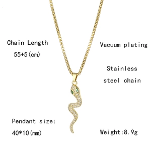 Detail view of gold snake pendant with cubic zirconia eyes and stainless steel chain dimensions