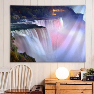 Macro detail of high-quality polyester wall tapestry with vibrant waterfall night scene