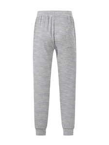 Detailed view of grey waffle knit fabric texture and back pocket on casual mens pants