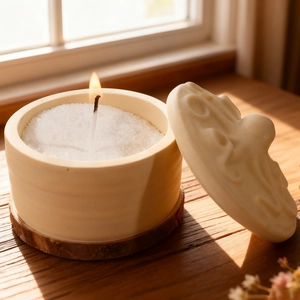 Scented candle in matte ceramic octopus jar with lid on wooden base, natural lighting