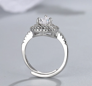 Macro detail of silver adjustable ring with halo setting and sparkling cubic zirconia