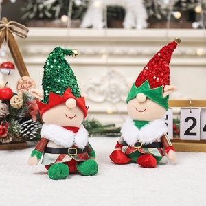 Christmas gnome plush dolls set with sequin hats and bells in cozy holiday setting