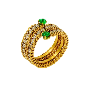 Close-up of 18K gold-plated chain ring featuring sparkling zircons and green gemstones