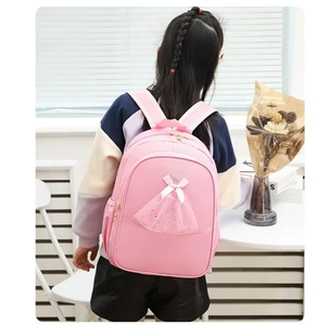 Pink ballet backpack for girls featuring a 3D tulle tutu dress and golden bow detail