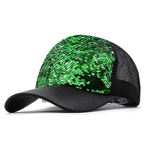 Detailed view of emerald green sequins and breathable black mesh on baseball cap