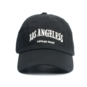 Detail shot of LOS ANGELES vintage embroidery on black cotton twill baseball cap