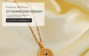 Macro shot of gold compass pendant with black gemstone on satin background