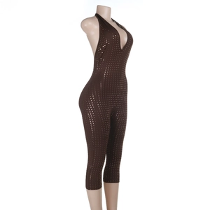 Side view of brown sequin halter jumpsuit with slim fit and deep V-neckline
