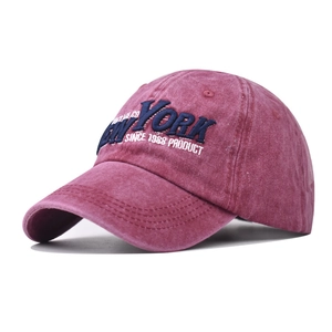 Macro shot of 3D embroidered New York vintage logo on washed cotton baseball cap