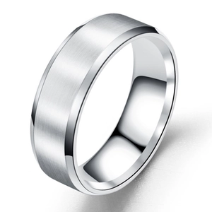 Macro shot of silver brushed stainless steel ring with polished beveled edges and matte finish