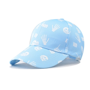 Close-up of cotton twill baseball cap with white skull and BOO prints in light blue