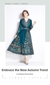 Detail of elegant V-neck dress featuring intricate paisley patterns and tie waist belt