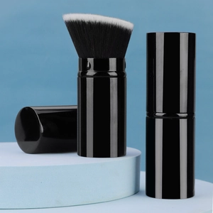Detail of angled foundation brush with soft dual-tone bristles and protective cap cover
