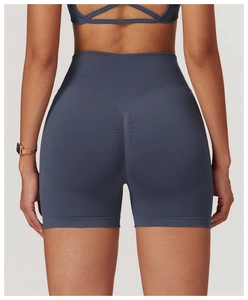 Macro detail of high-waist yoga shorts showing gray-blue seamless knit and scrunch butt design