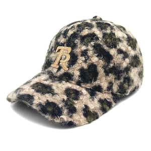 Close-up of leopard print teddy fleece baseball cap with gold embroidered letter R